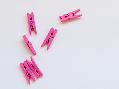 image of six pink clothes clips