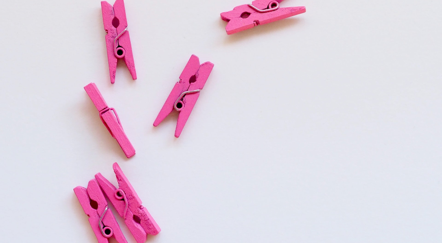 image of six pink clothes clips