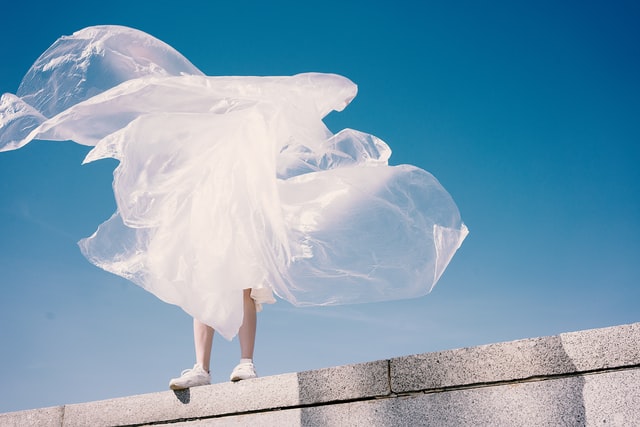 image of a person holding plastic